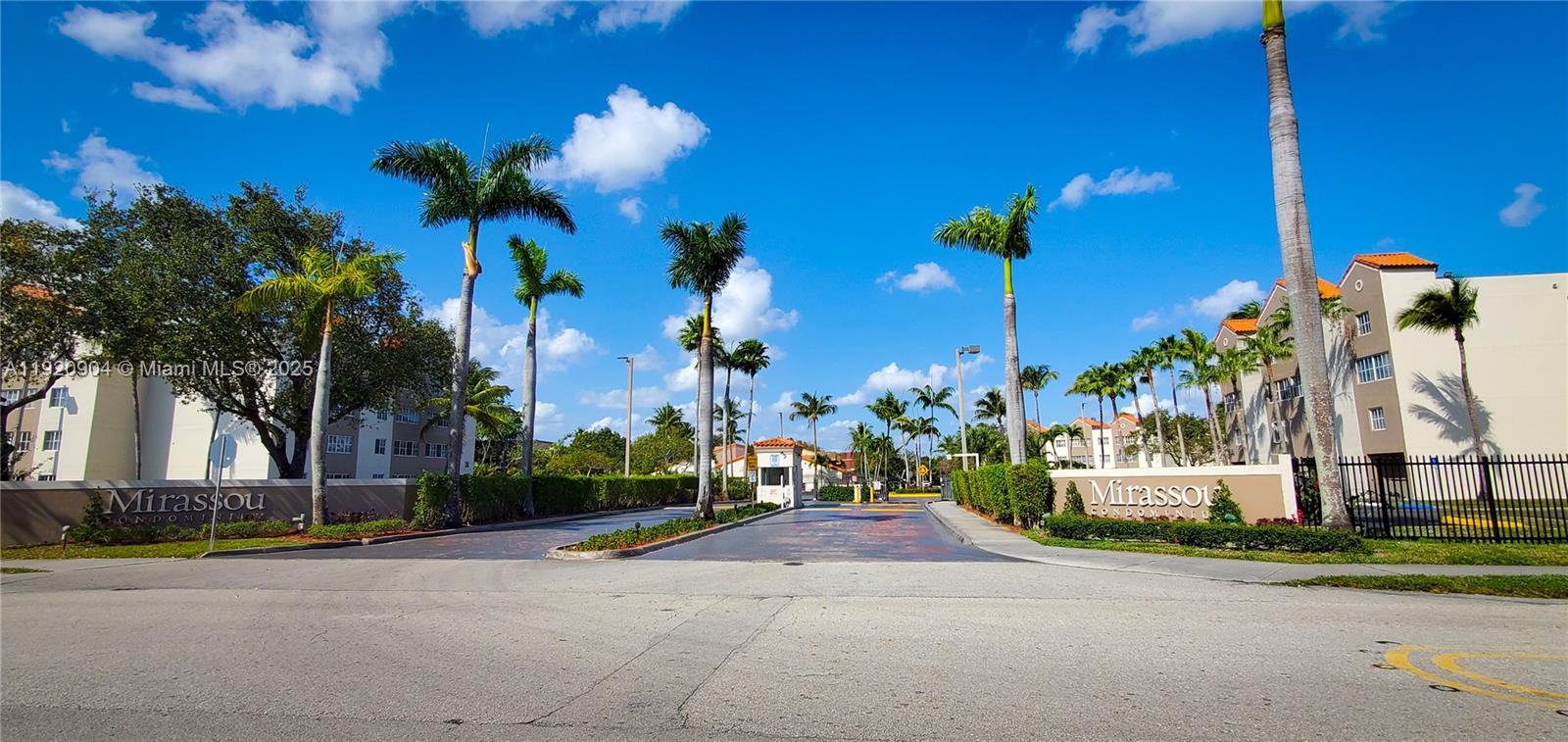 6065 Northwest 186th Street, Unit 106 Hialeah, FL 33015 - Photo 5 of 20 a view of a house with a yard and a street