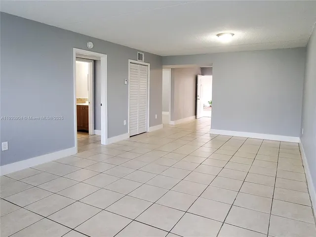 a bathroom with a toilet sink and shower