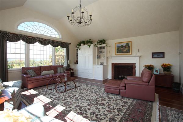 188 Prospect Hill Road Harvard, MA 01451 - Photo 12 of 30 a living room with furniture a fireplace and a chandelier