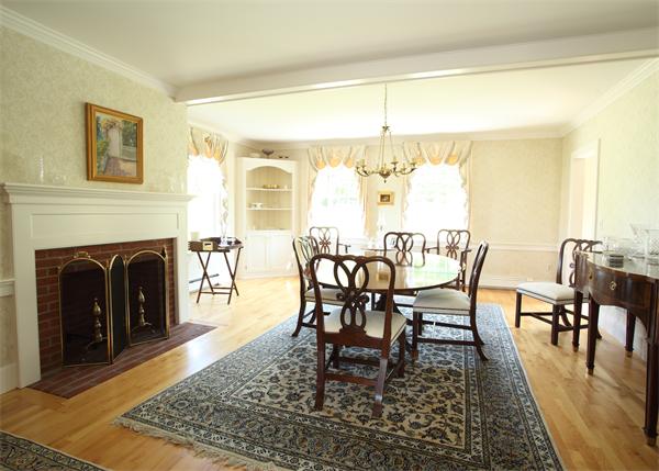 188 Prospect Hill Road Harvard, MA 01451 - Photo 15 of 30 a dining room with furniture a rug and a fireplace