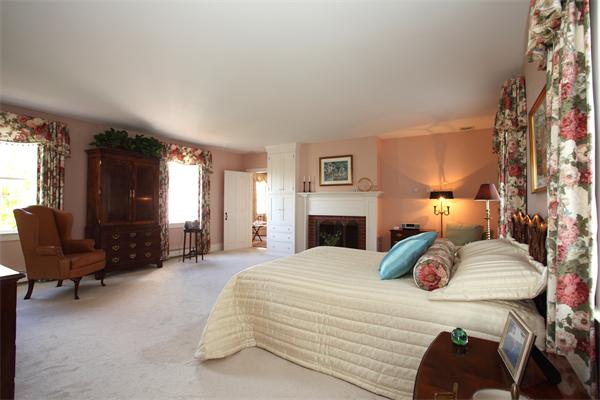188 Prospect Hill Road Harvard, MA 01451 - Photo 21 of 30 a bedroom with a bed chair and fireplace
