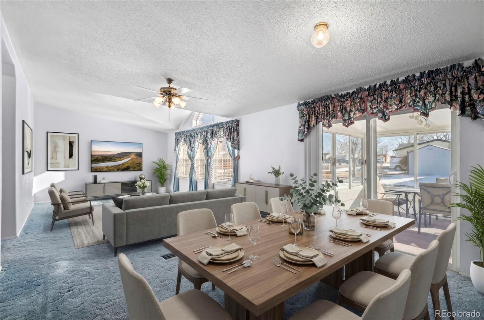 185 Elm Street Hudson, CO 80642 - Photo 15 of 43 a living room with furniture and a large window