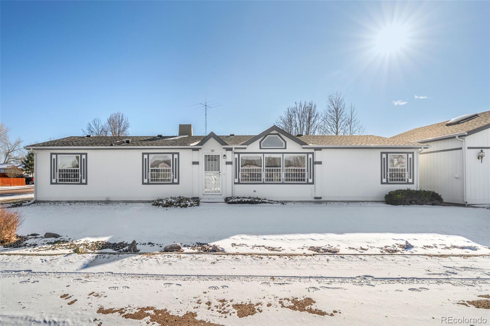 185 Elm Street Hudson, CO 80642 - Photo 2 of 43 a view of a white house