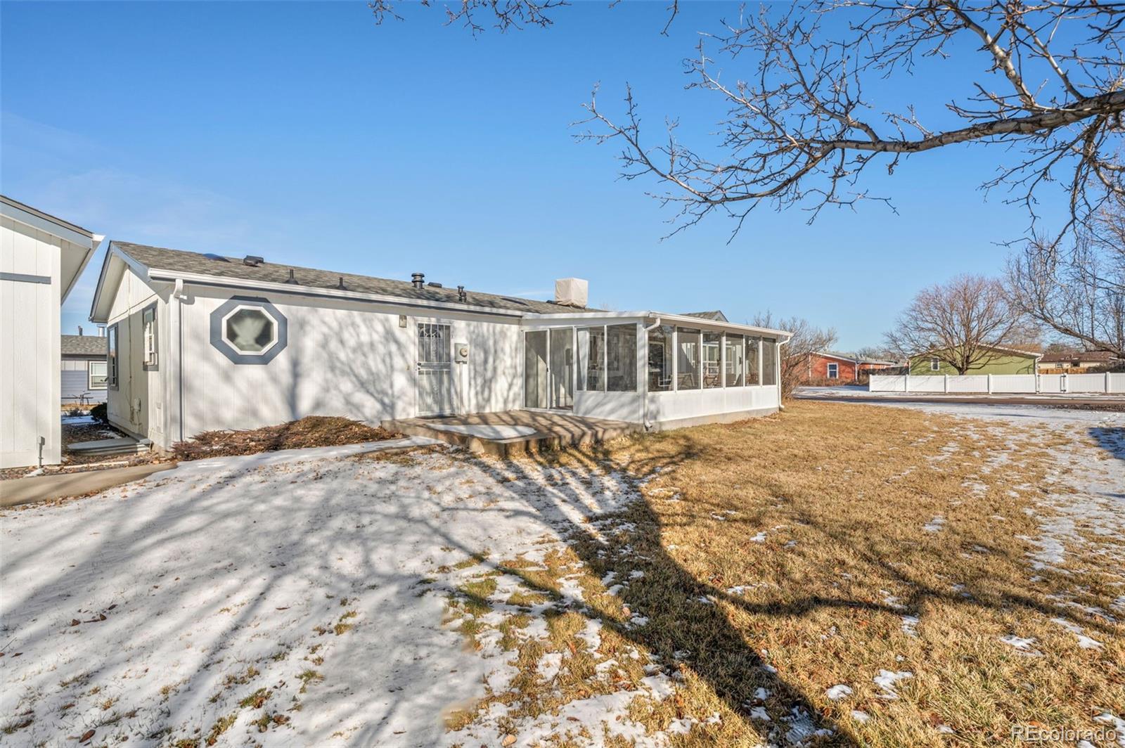 185 Elm Street Hudson, CO 80642 - Photo 34 of 43 a view of a house with a snow on the road