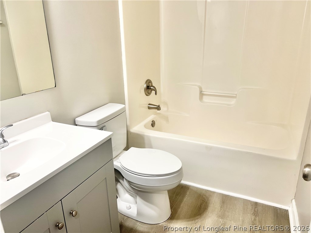 1523 Rough Rider Lane Parkton, NC 28371 - Photo 36 of 42 a bathroom with a sink a toilet and a bathtub