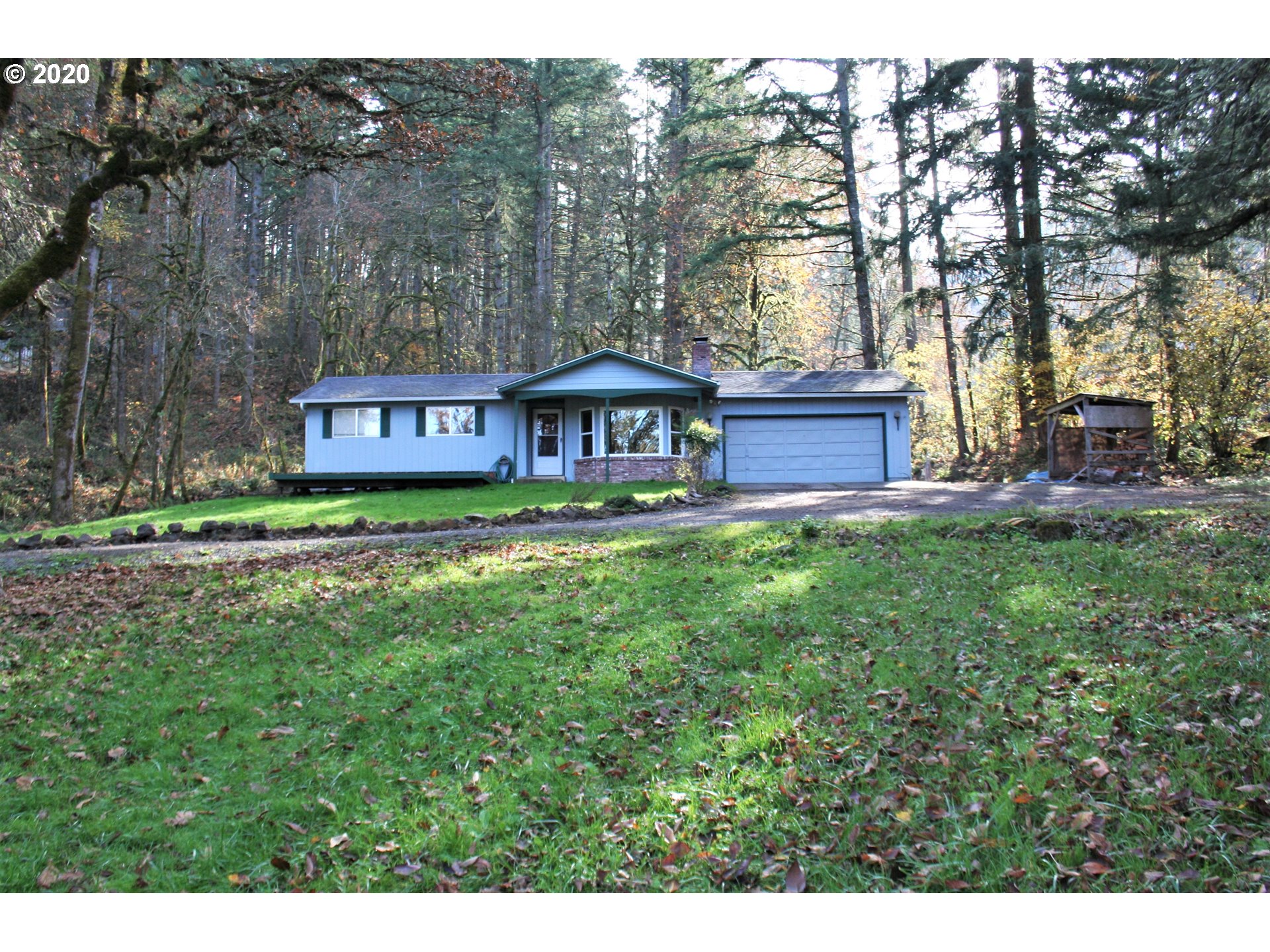 1042 South 70th Street Springfield, OR 97478 - Photo 1 of 18 a view of a house with a yard and sitting area