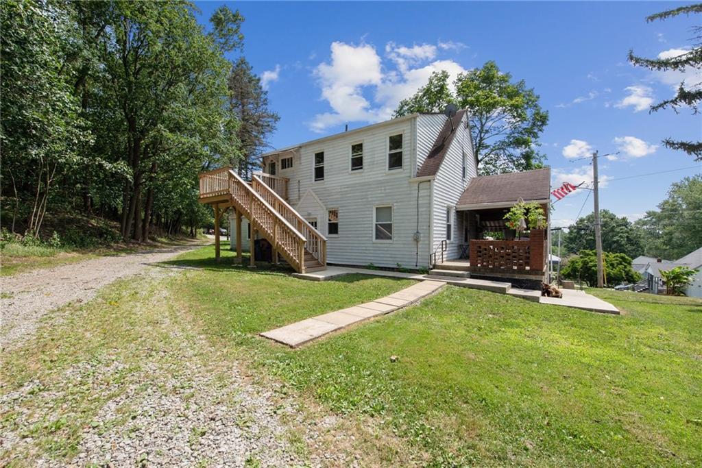 501 Francis Road Pittsburgh, PA 15239 - Photo 3 of 11 a view of a house with backyard and sitting area