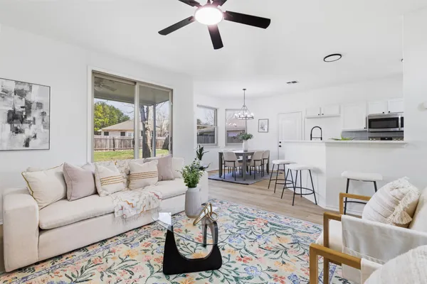 a living room with furniture and a large window