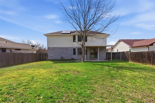 a view of a house with a back yard