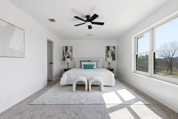 a bed room with a bed and a window