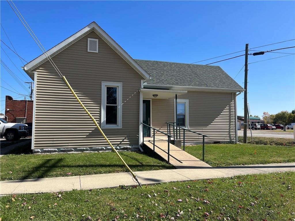 a front view of a house with a yard