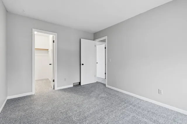 a view of livingroom with furniture and white walls