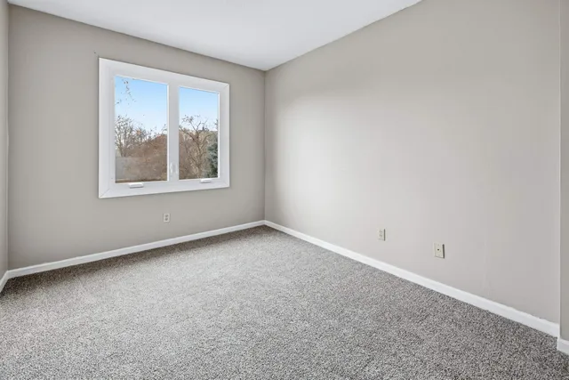 a view of an empty room with stairs