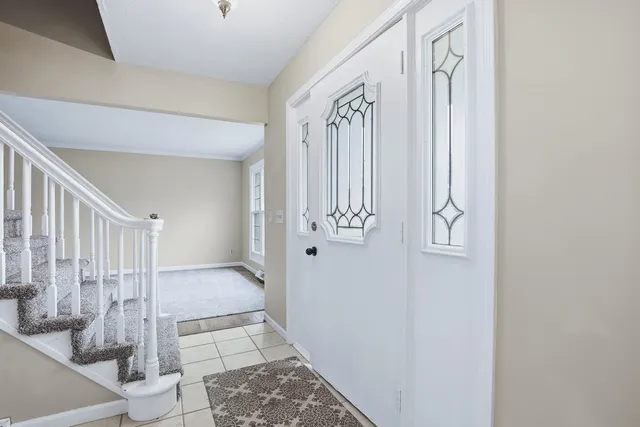 a kitchen with stainless steel appliances granite countertop a sink a stove a refrigerator and island