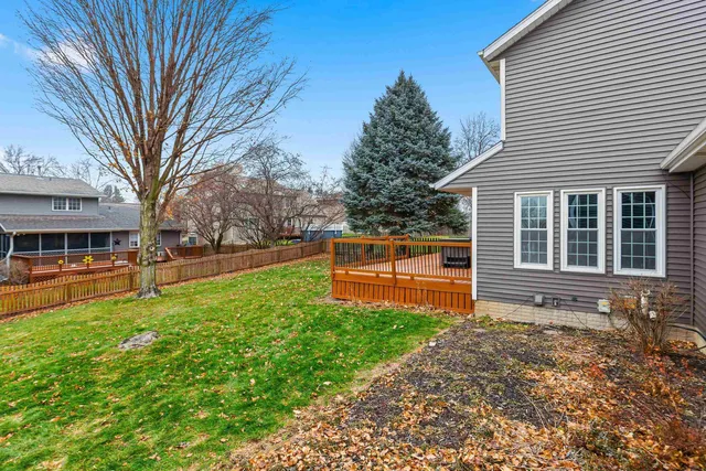 a view of a house with a yard porch and sitting area