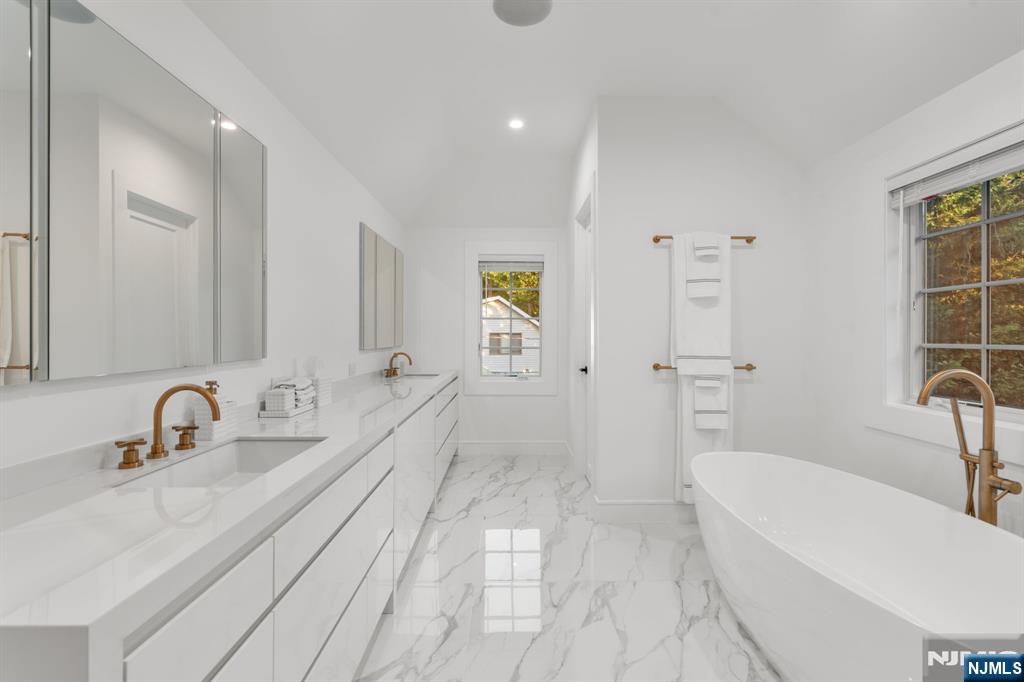 306 Hutchinson Road Englewood, NJ 07631 - Photo 20 of 50 a bathroom with a sink a toilet and shower