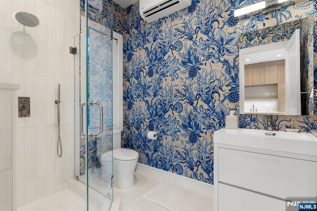 306 Hutchinson Road Englewood, NJ 07631 - Photo 38 of 50 a bathroom with a sink toilet and shower