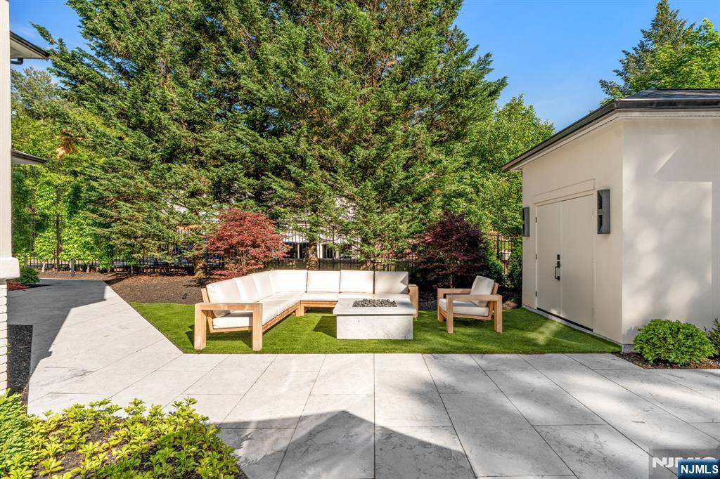 306 Hutchinson Road Englewood, NJ 07631 - Photo 39 of 50 a view of a backyard with a garden and plants