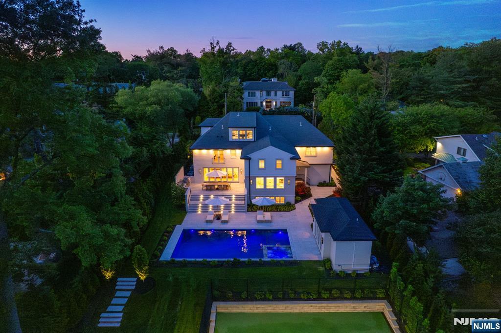 306 Hutchinson Road Englewood, NJ 07631 - Photo 50 of 50 aerial view of a house with a yard and a large tree