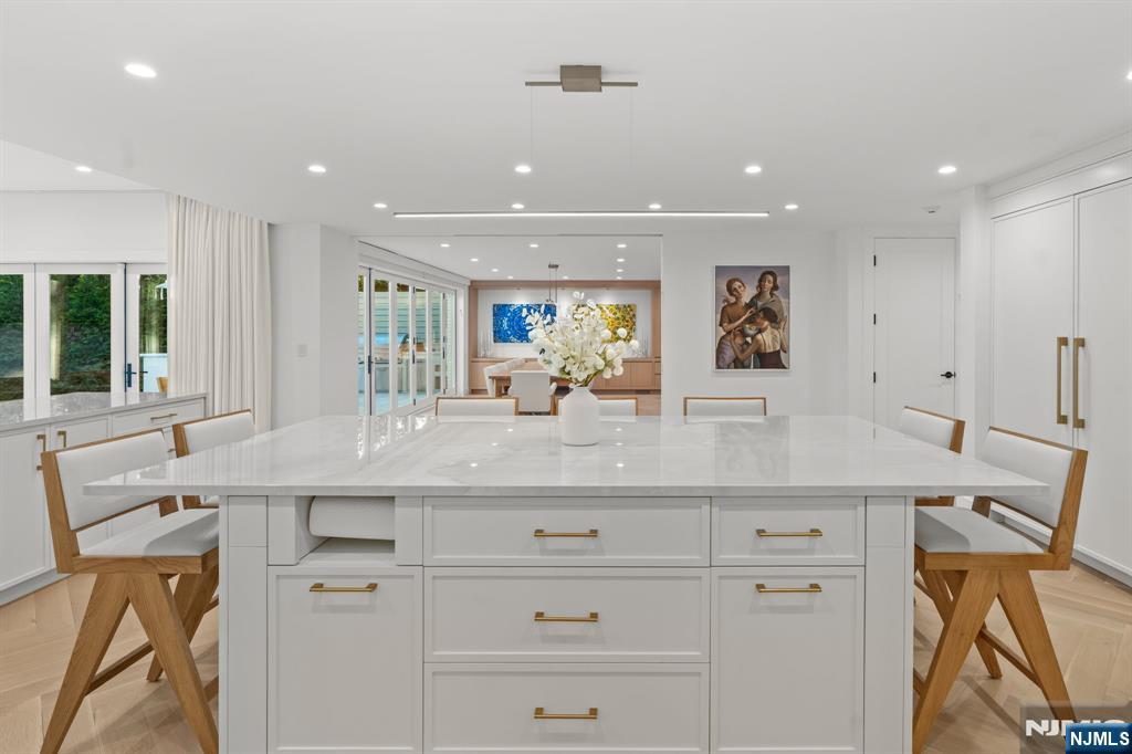 306 Hutchinson Road Englewood, NJ 07631 - Photo 6 of 50 a kitchen with a sink stainless steel appliances and cabinets