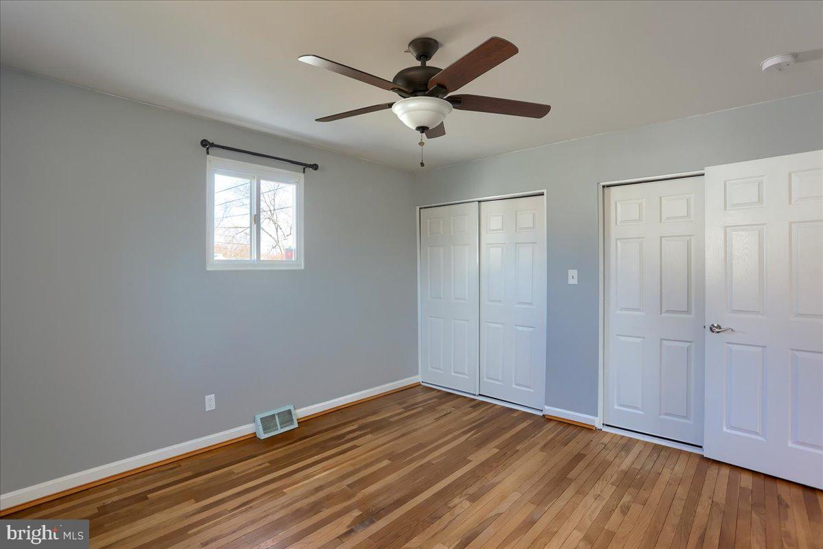 104 Cedarcliff Court Glen Burnie, MD 21060 - Photo 12 of 34 a view of empty room with wooden floor