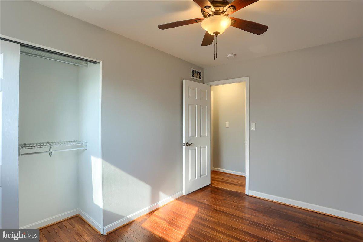 104 Cedarcliff Court Glen Burnie, MD 21060 - Photo 17 of 34 a view of empty room with wooden floor