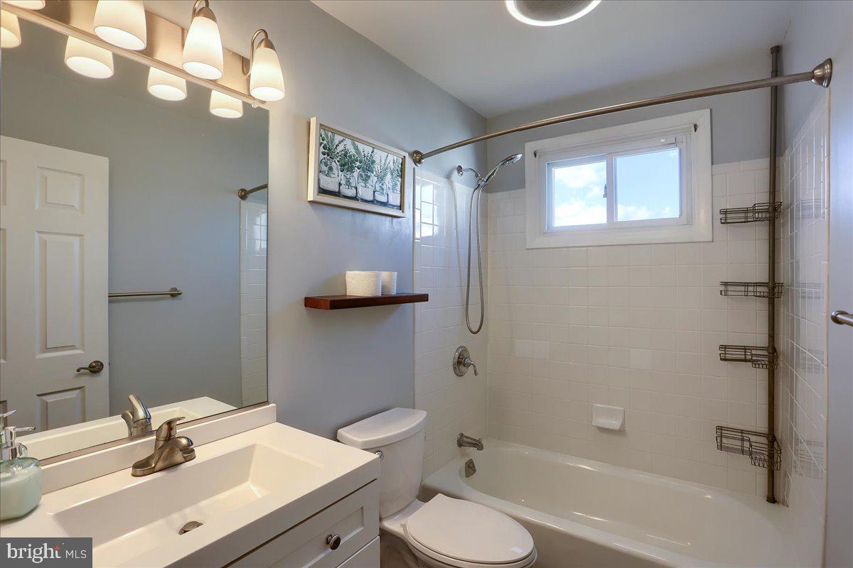 104 Cedarcliff Court Glen Burnie, MD 21060 - Photo 18 of 34 a bathroom with a sink toilet tub and shower