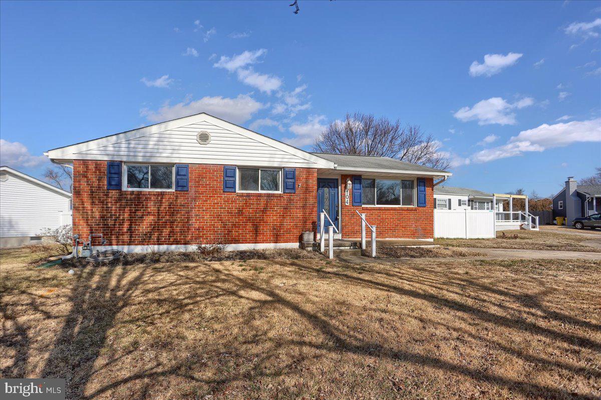 104 Cedarcliff Court Glen Burnie, MD 21060 - Photo 3 of 34 a front view of a house with a yard