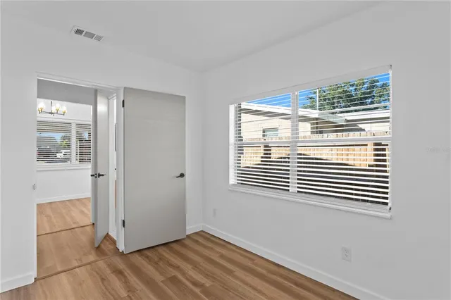 a view of a room that has a window in it