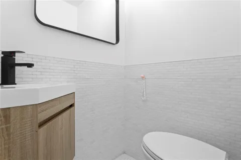 a bathroom with a toilet and a sink