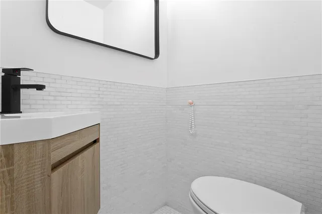 a bathroom with a toilet and a sink