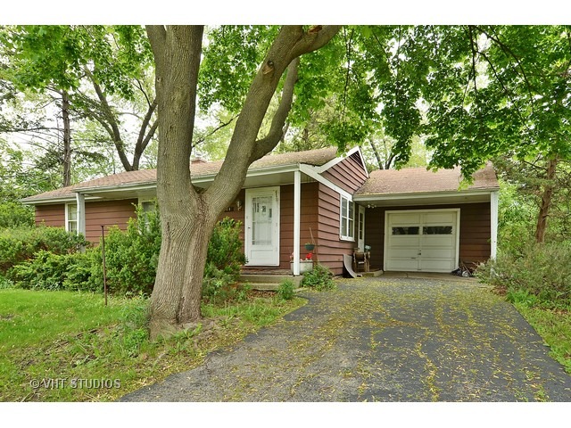 401 Warren Road Glenview, IL 60025 - Photo 1 of 10 a front view of a house with a garden