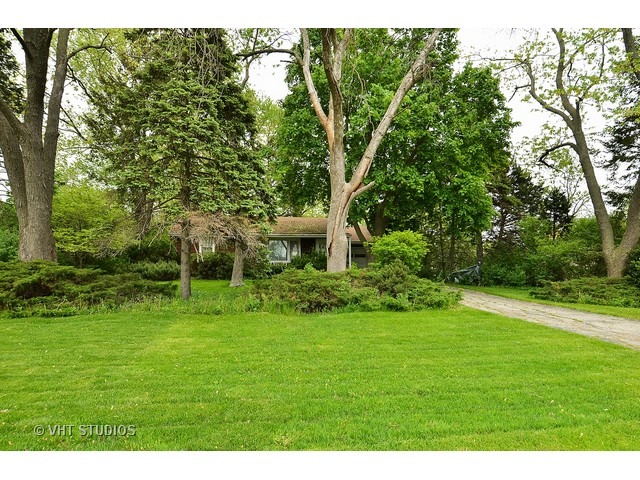 401 Warren Road Glenview, IL 60025 - Photo 2 of 10 a view of a grassy field with trees in the background
