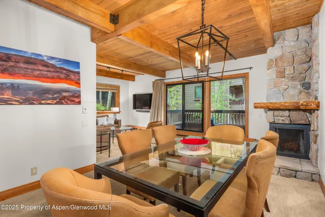 a outdoor living space with furniture and chandelier
