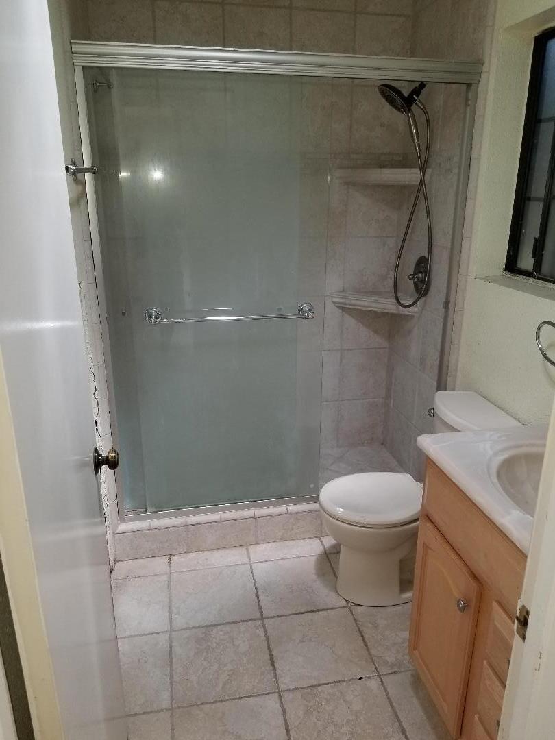 569 Powell Street Salinas, CA 93907 - Photo 12 of 14 a bathroom with a toilet and a shower
