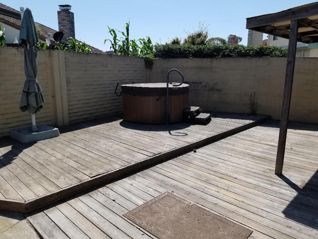 569 Powell Street Salinas, CA 93907 - Photo 3 of 14 a wooden bench sitting on top of a wooden deck