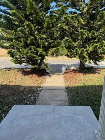 a view of yard with an outdoor space