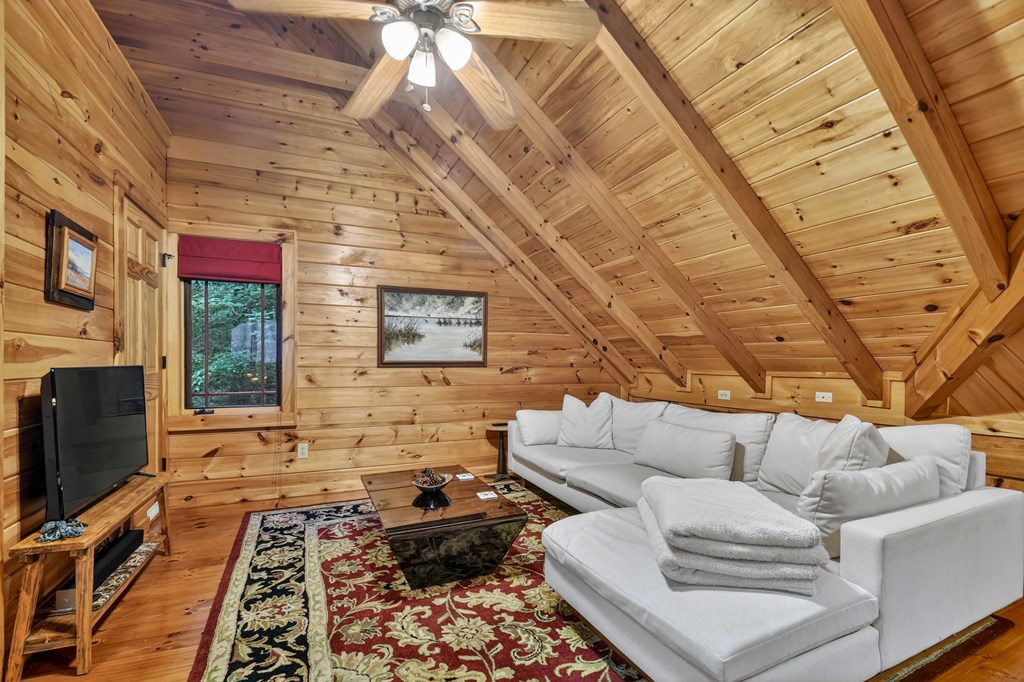 300 River Road Cherry Log, GA 30522 - Photo 25 of 119 a living room with furniture and a flat screen tv