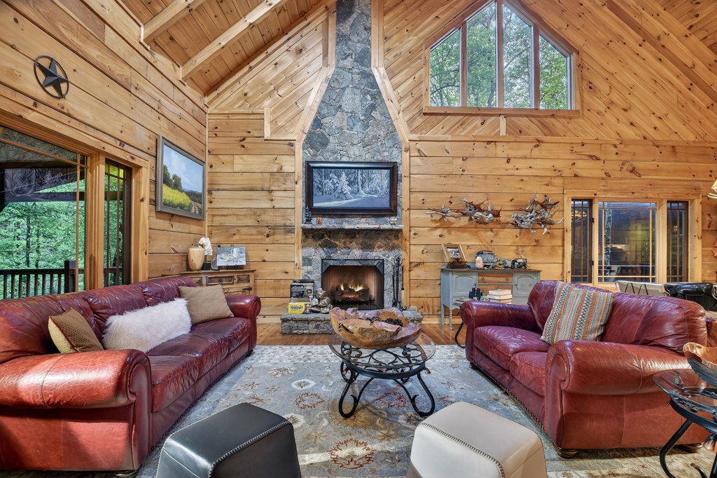 300 River Road Cherry Log, GA 30522 - Photo 30 of 119 a living room with furniture a fireplace and window