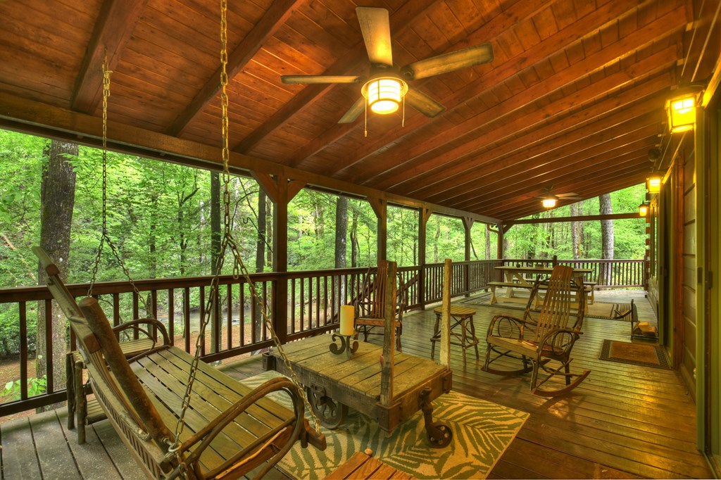 300 River Road Cherry Log, GA 30522 - Photo 48 of 119 a view of a patio with a table chairs and wooden floor