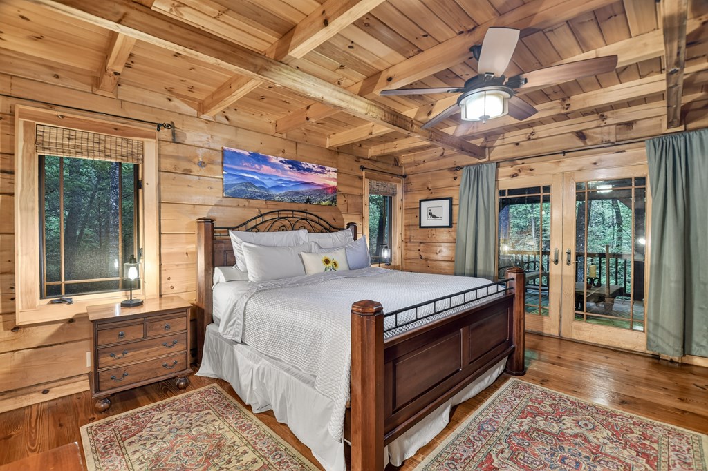 300 River Road Cherry Log, GA 30522 - Photo 10 of 119 a bed sitting in a spacious bedroom next to a window
