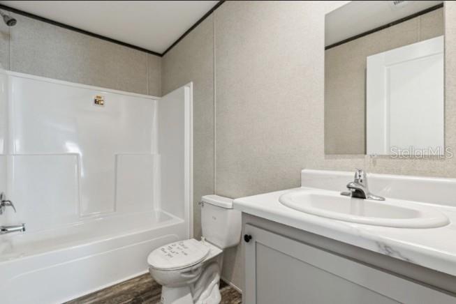 27760 Bermont Road Punta Gorda, FL 33982 - Photo 15 of 18 a bathroom with a sink toilet and shower