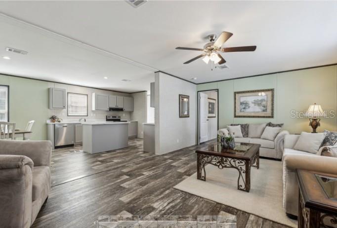 27760 Bermont Road Punta Gorda, FL 33982 - Photo 6 of 18 a living room with furniture and kitchen view