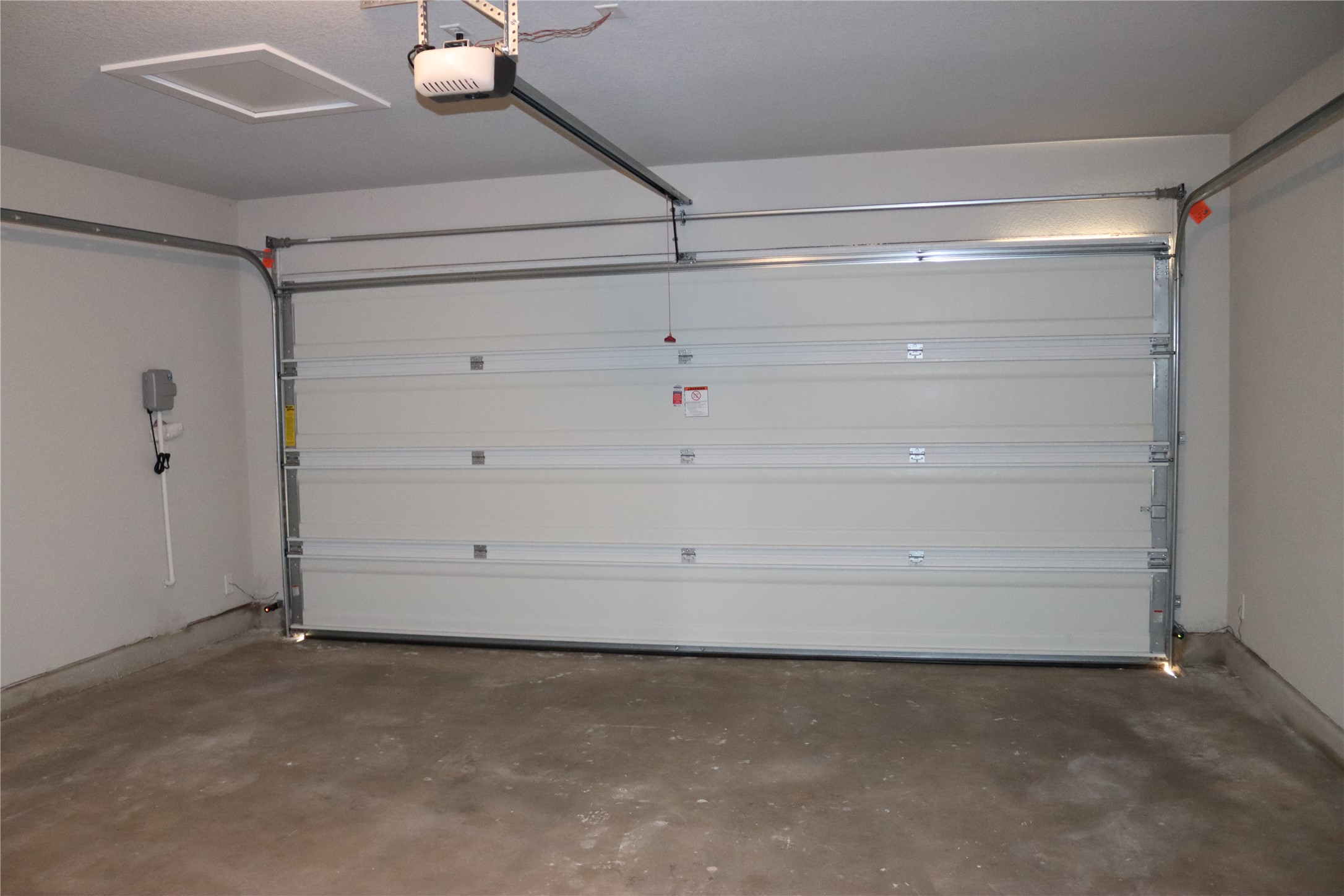 225 Graver Street Georgetown, TX 78626 - Photo 14 of 19 Garage with a garage door opener
