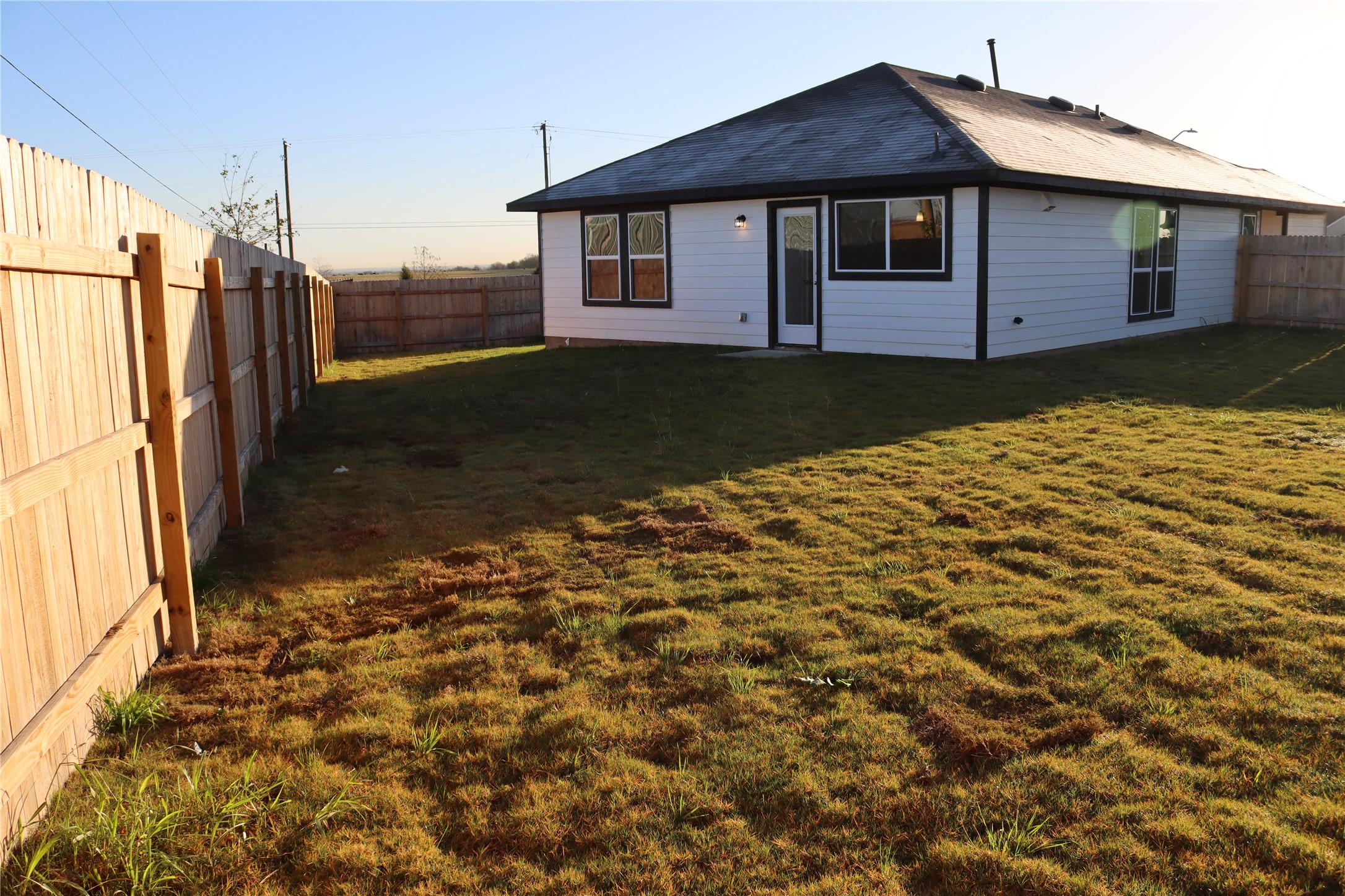 225 Graver Street Georgetown, TX 78626 - Photo 18 of 19 Rear view of property featuring a fenced backyard