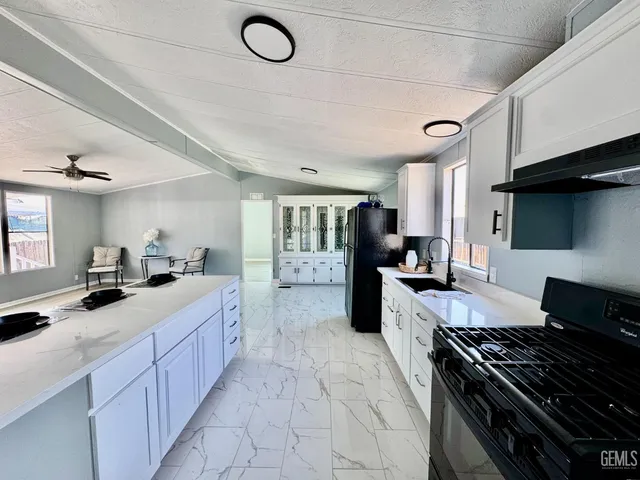 a kitchen with a stove and a sink