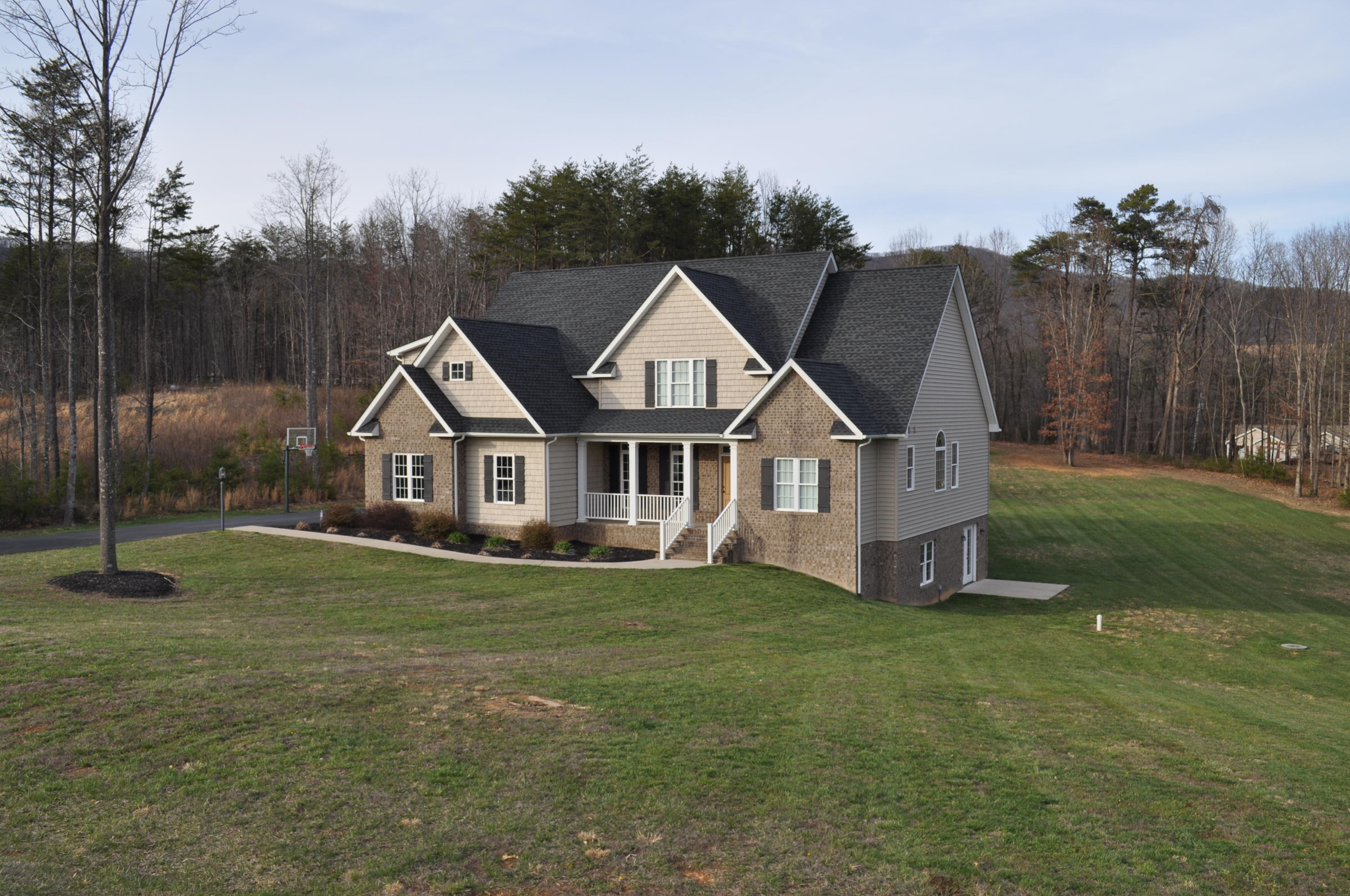 632 Thornblade Way Blue Ridge, VA 24064 - Photo 1 of 41 a front view of a house with garden