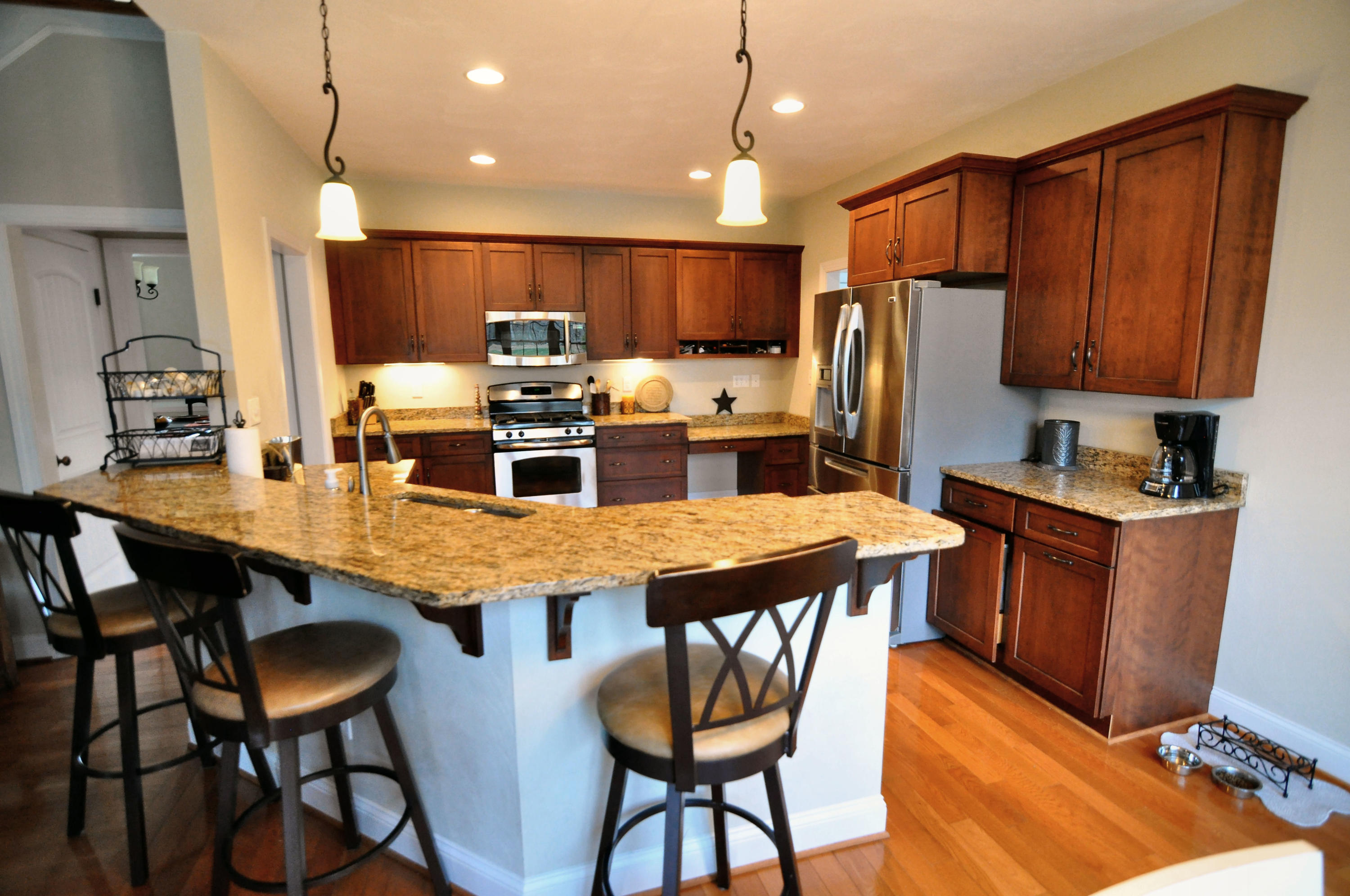 632 Thornblade Way Blue Ridge, VA 24064 - Photo 14 of 41 a kitchen with stainless steel appliances granite countertop a table chairs stove refrigerator and cabinets
