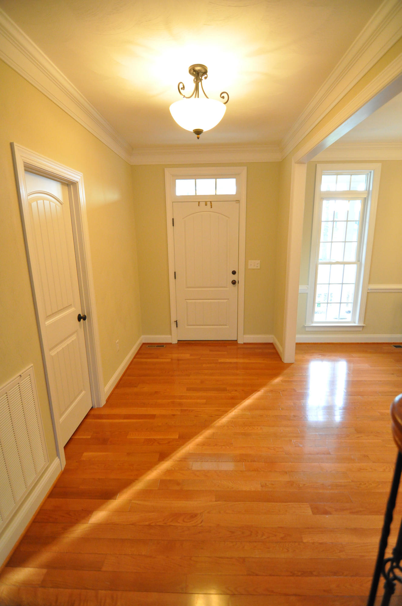 632 Thornblade Way Blue Ridge, VA 24064 - Photo 3 of 41 a view of an empty room with window and wooden floor
