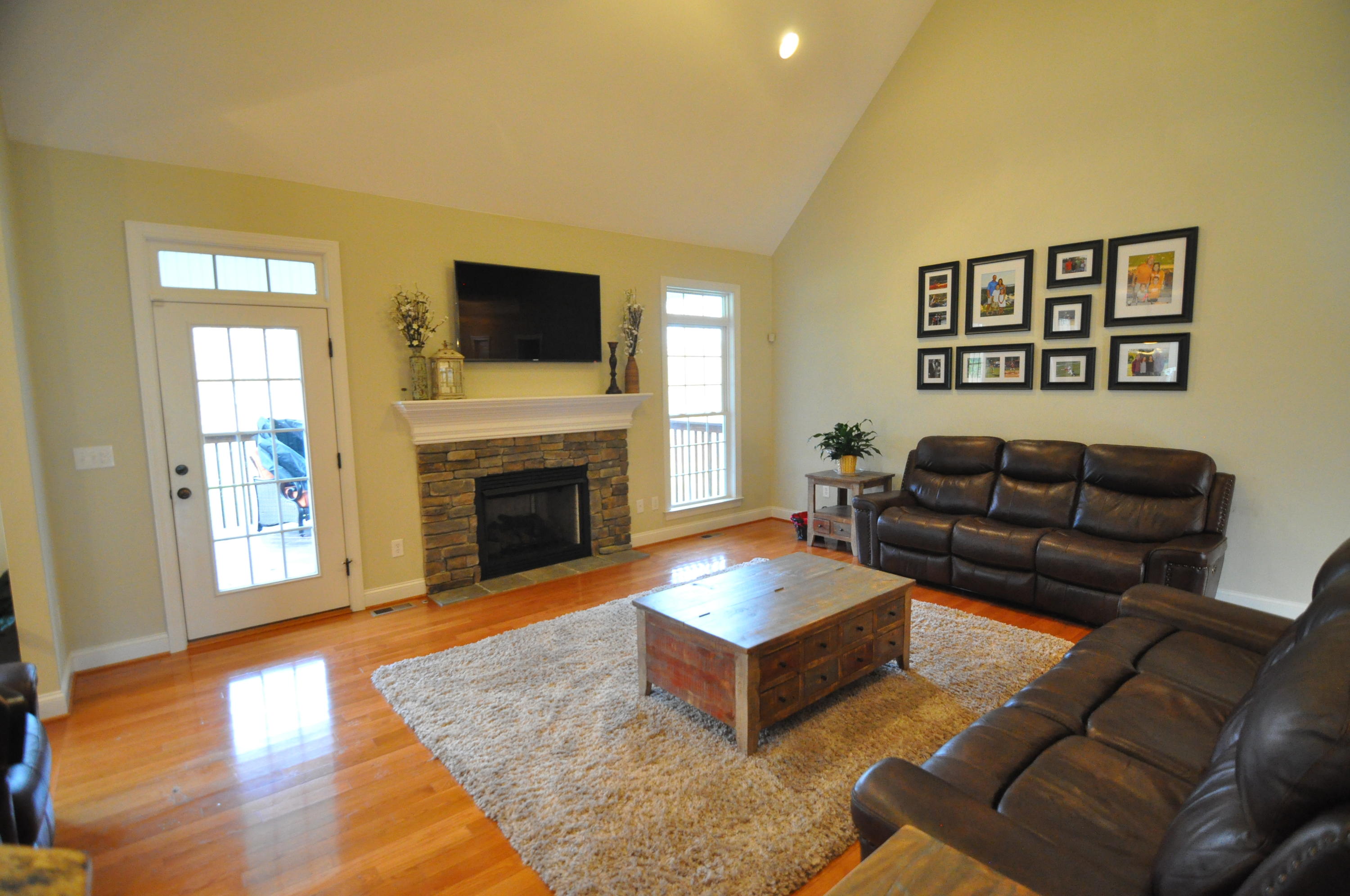 632 Thornblade Way Blue Ridge, VA 24064 - Photo 5 of 41 a living room with furniture flat screen tv and a fireplace